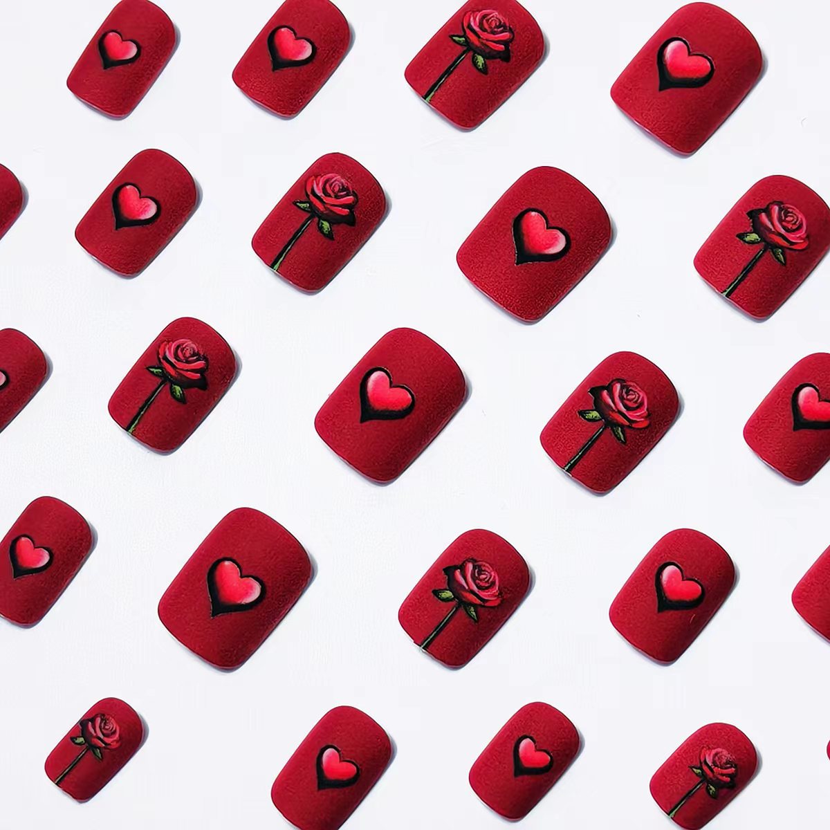 Artificial nails with romantic rose and heart design 
Maetiva