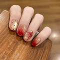 Artificial nails with festive gradient color and elegant decorations 
Maetiva