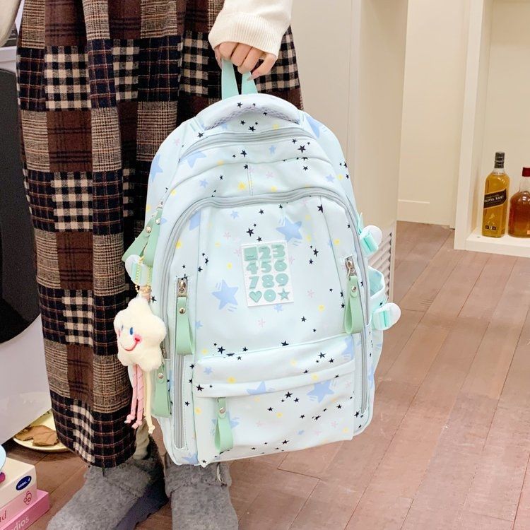 Playful backpack with star motifs and practical functions 
Maetiva