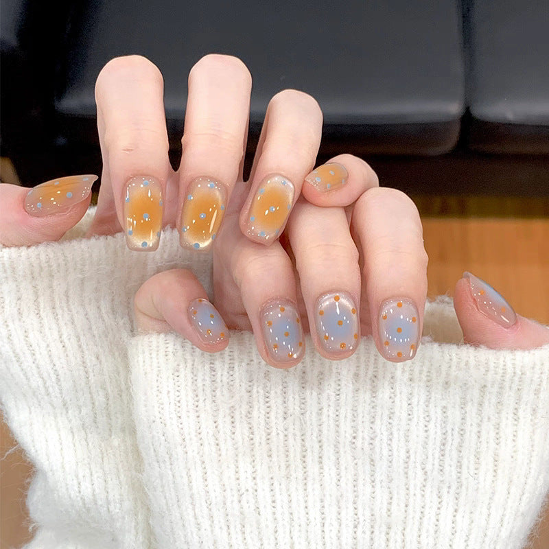 Ombre Stiletto Press-On Nail Art with Gem Accents 
Maetiva
