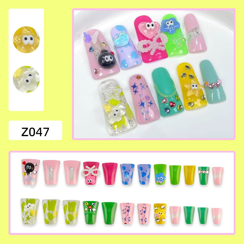 Creative press-on nails with playful 3D designs 
Maetiva