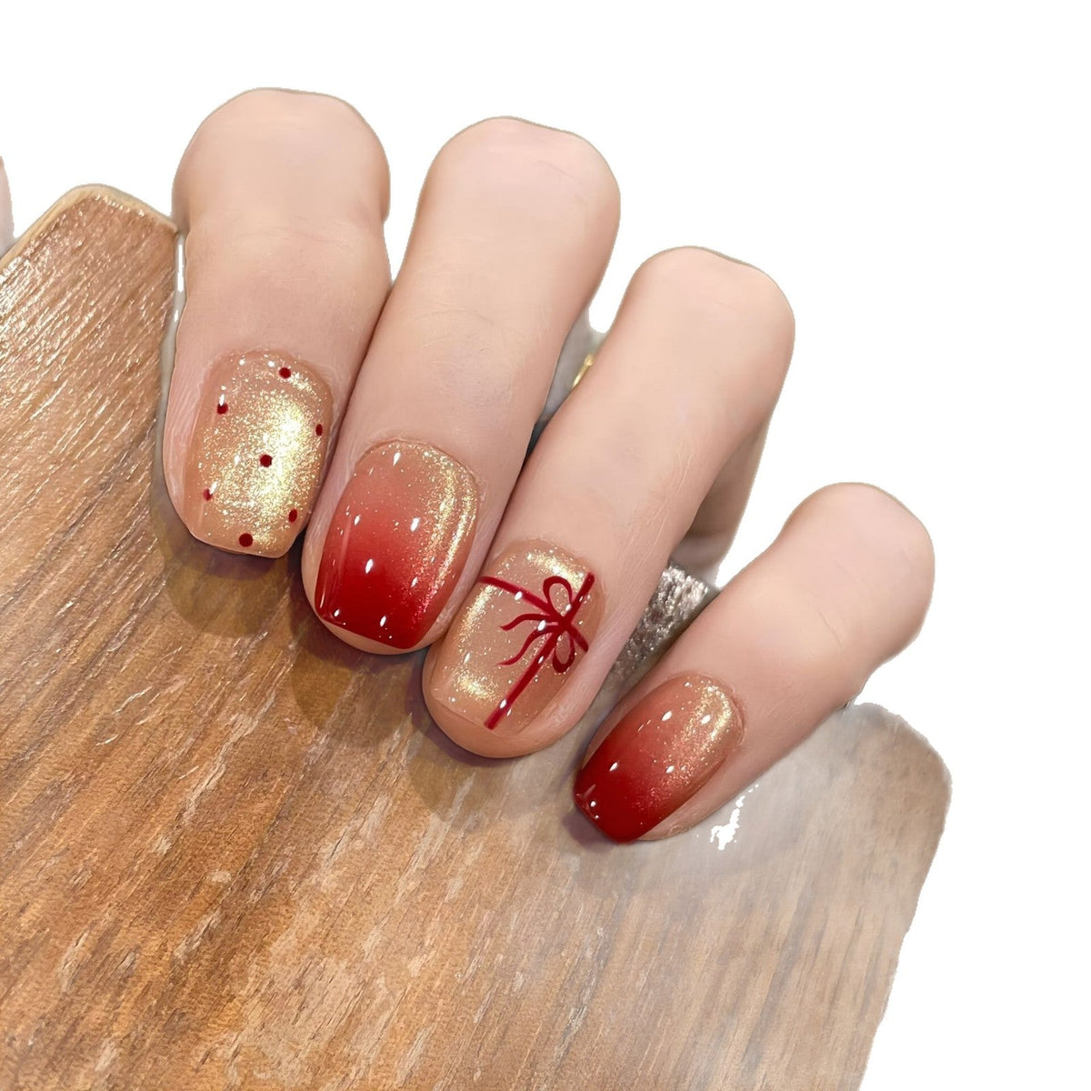 Artificial nails with festive gradient color and elegant decorations 
Maetiva