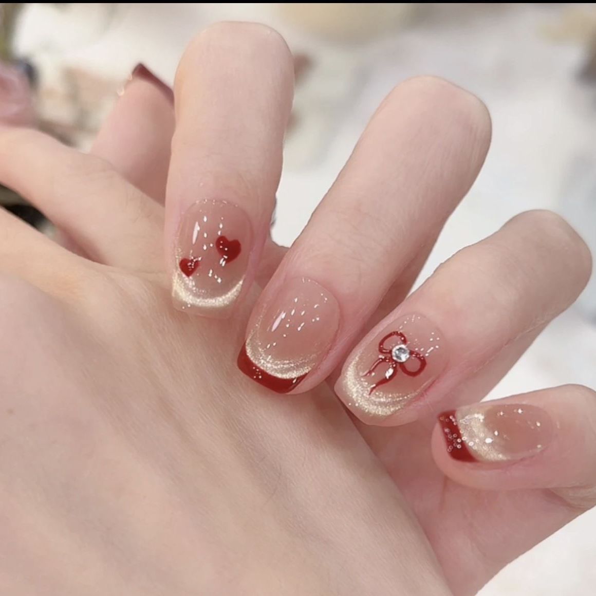 Artistic Nail Design with Decorative Elements 
Maetiva