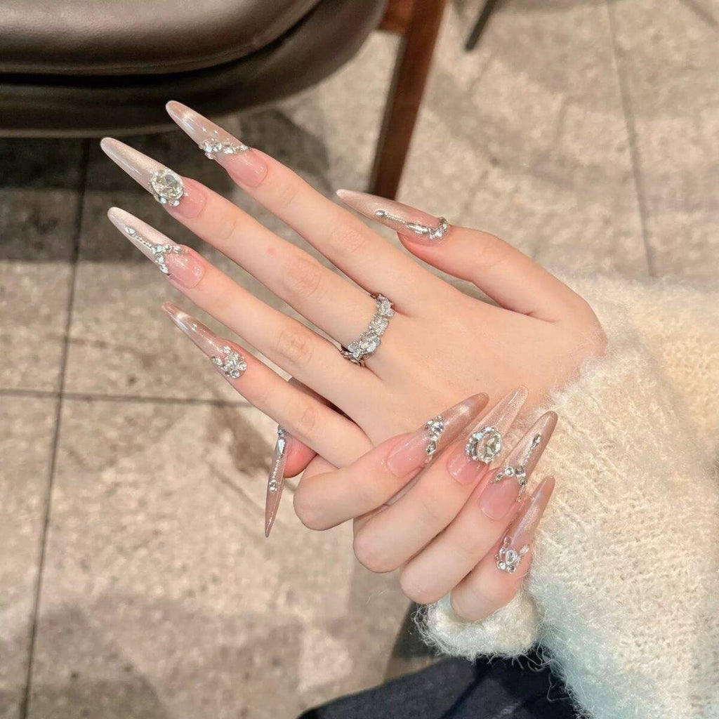 Artistic Nail Design with Decorative Elements 
Maetiva