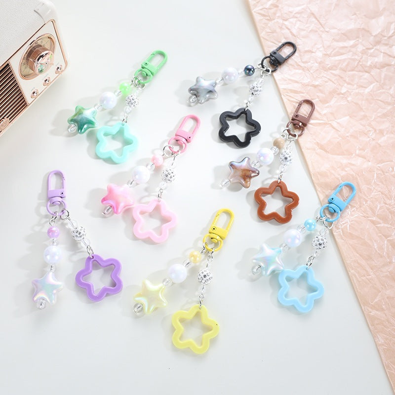 Playful keychain with floral and star motif 
Maetiva
