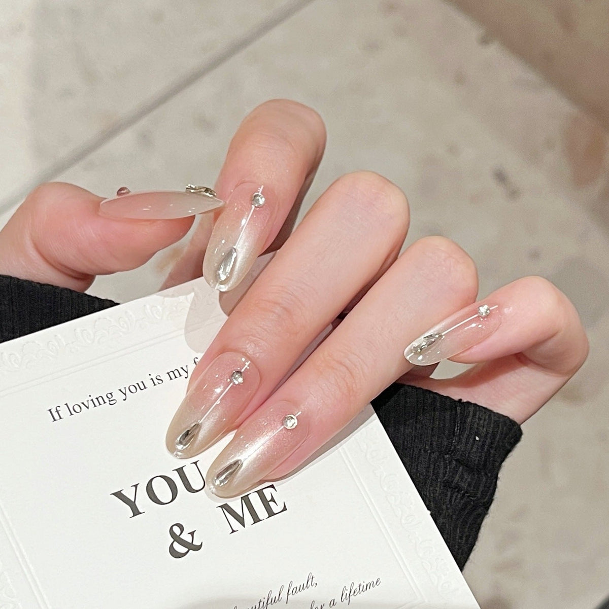 Artistic Nail Design with Decorative Elements 
Maetiva