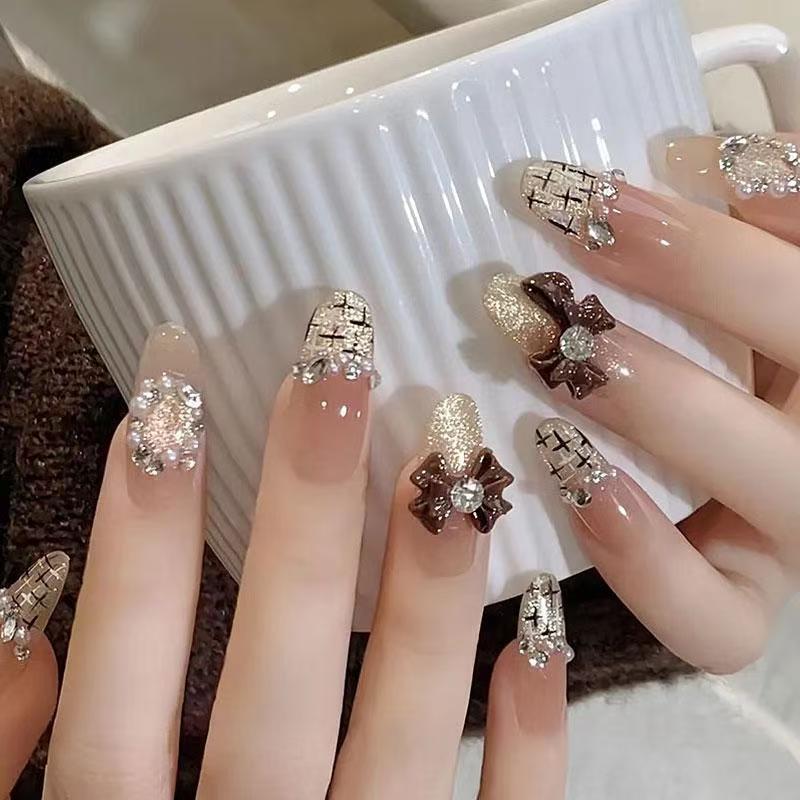 Ombre Stiletto Press-On Nail Art with Gem Accents 
Maetiva